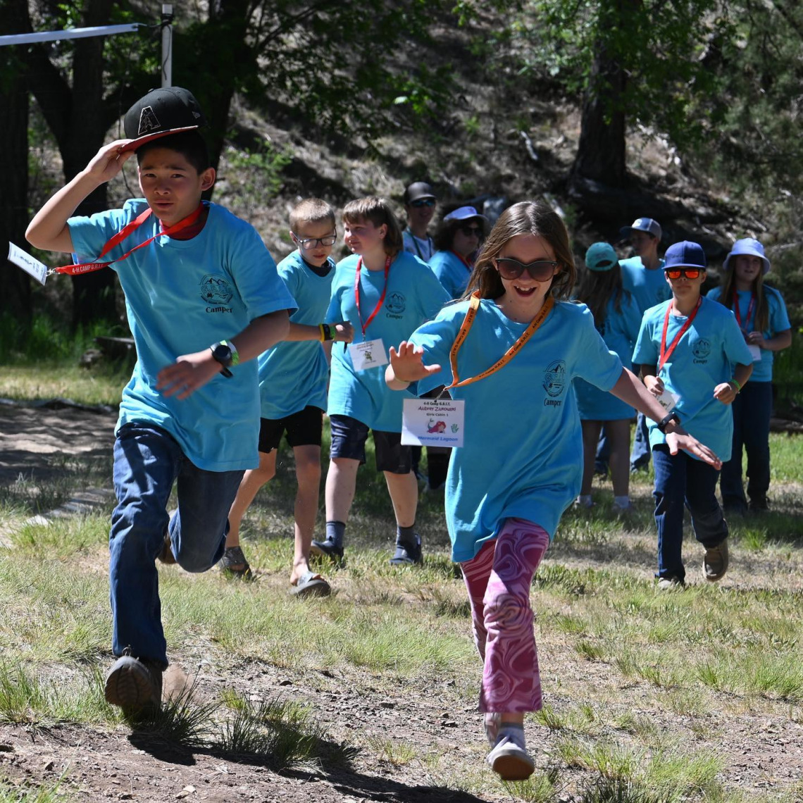 Photo of 4-H kids running at Camp GRIT