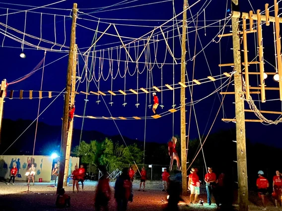 kids on high ropes course at night