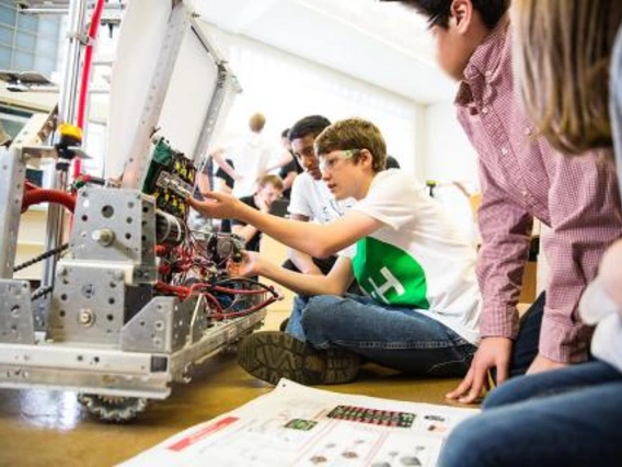 Kids working on a robot