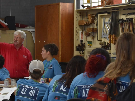 4-H volunteer teaching group of kids