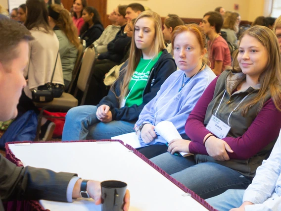 Teens talking with agriculture leader