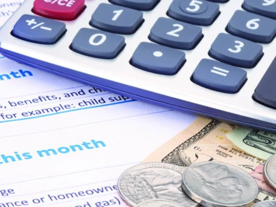 calculator and money on budget documents