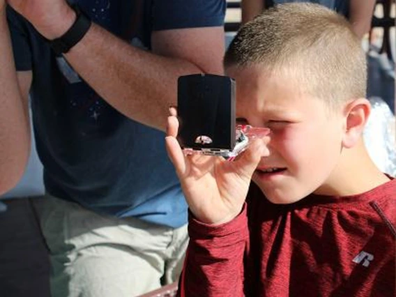 4-H member using a compass