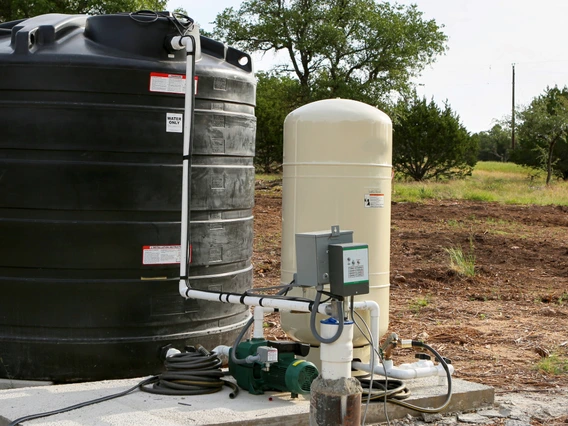 groundwater well with storage tank