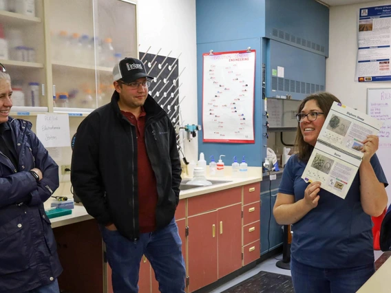 Instructor teaching group in water quality lab