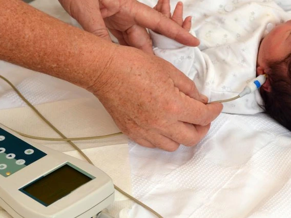 newborn getting hearing screening