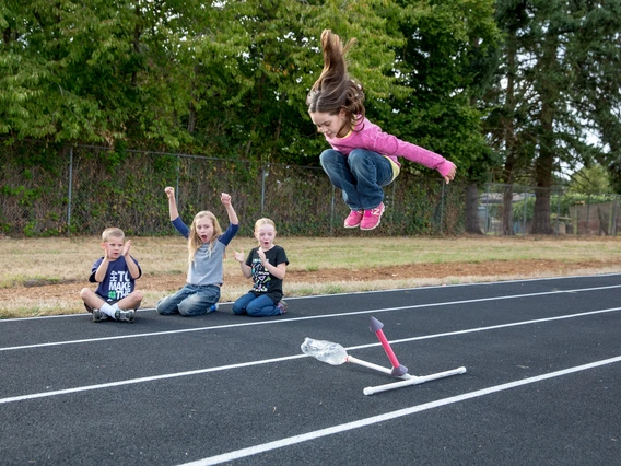 kid jumping on air rocket launcher