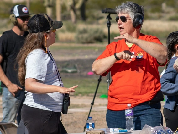 4-h shooting sports volunteer teaching youth