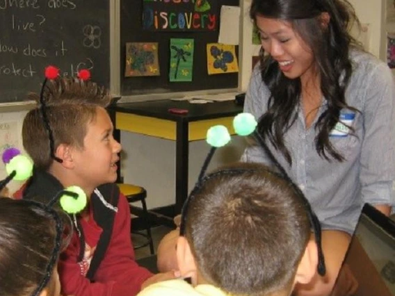 presenter with kids dressed as insects