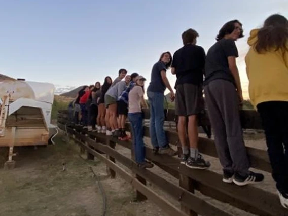 kids on fence at ranch