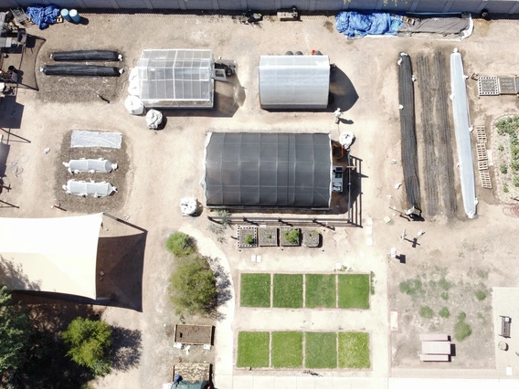 drone flying over small urban farm