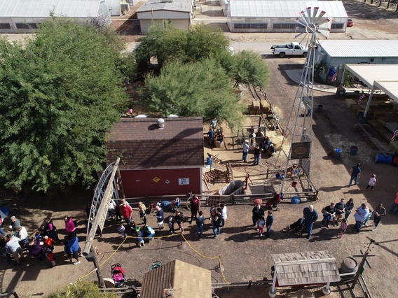 overhead drone photo of families entering the ag-ventures teaching farm