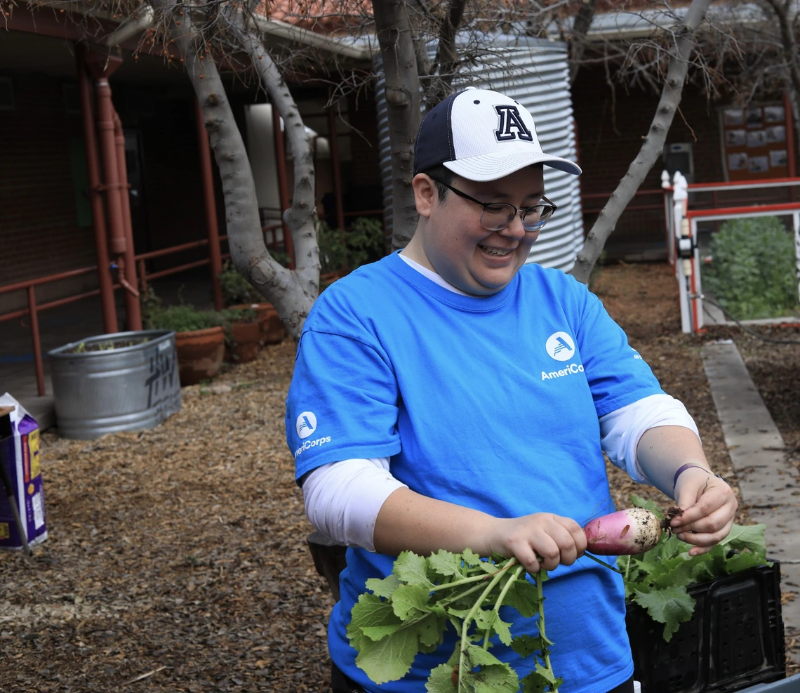 AmeriCorps member working in garden