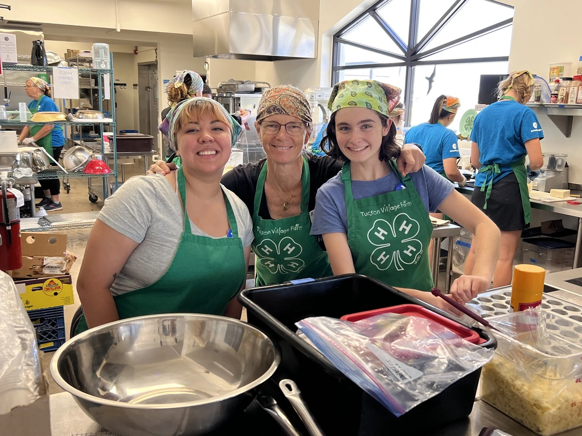 Women standing in a kitchen