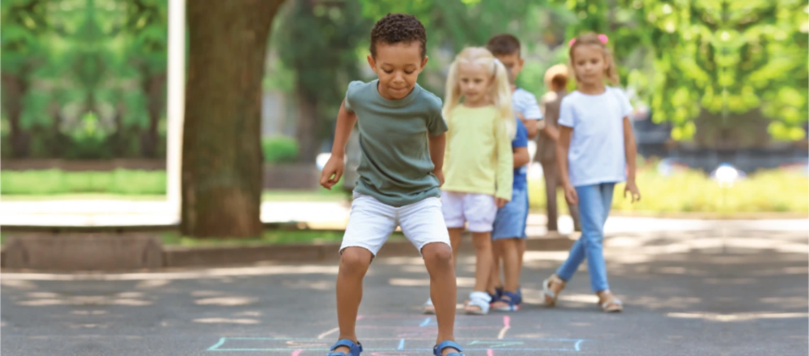 Children play hotscotch