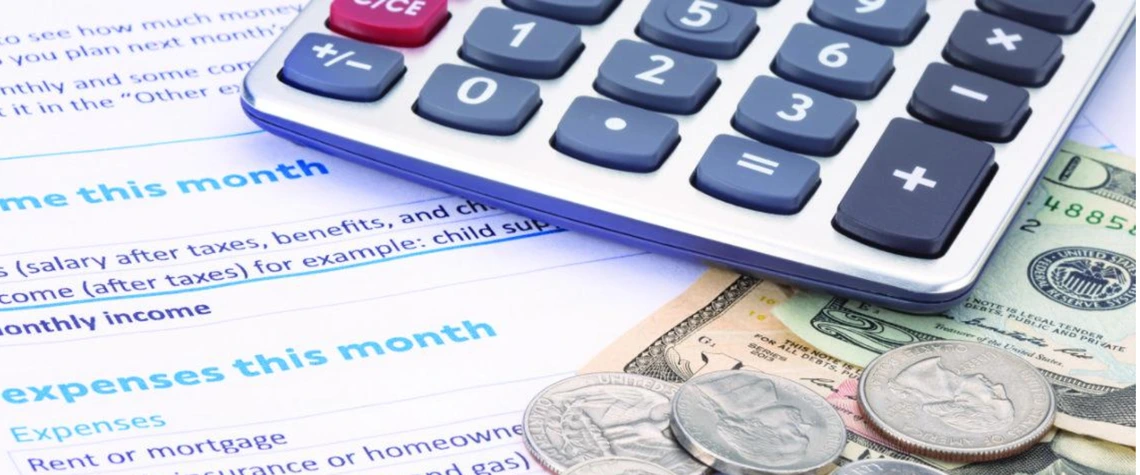 calculator and money on budget documents