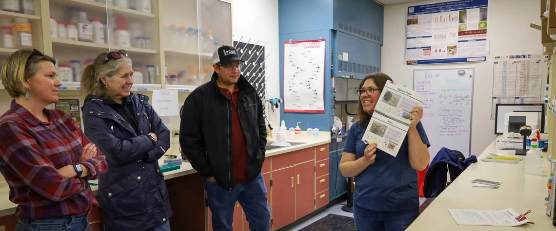 Instructor teaching group in water quality lab