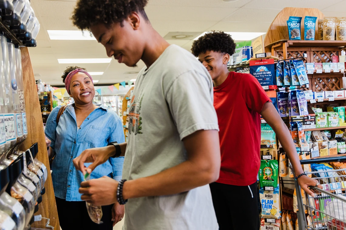 teens with parent at grocery store