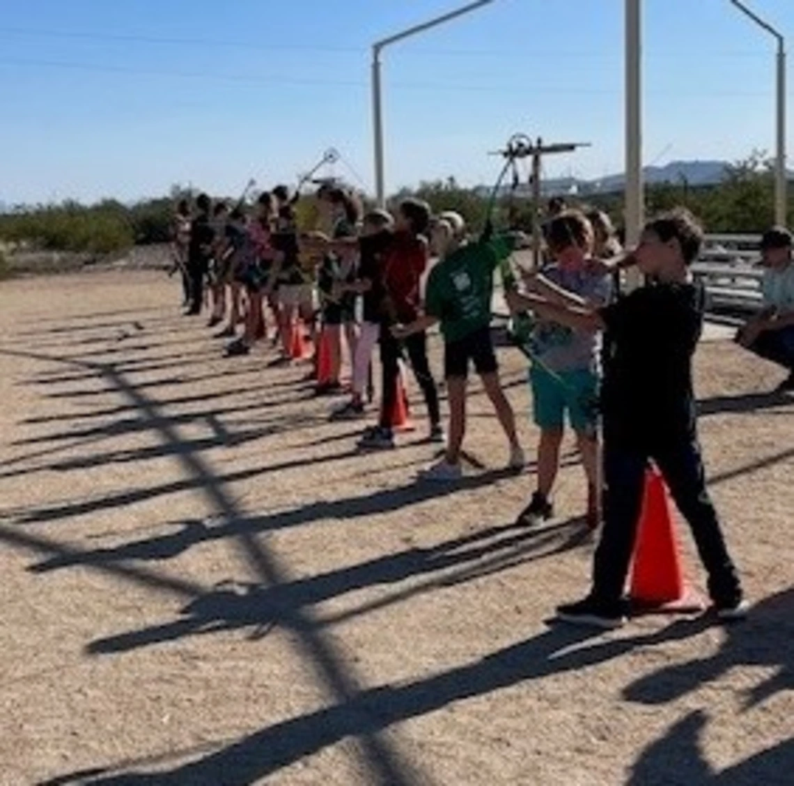 4-H youth at archery shooting range ready to shoot