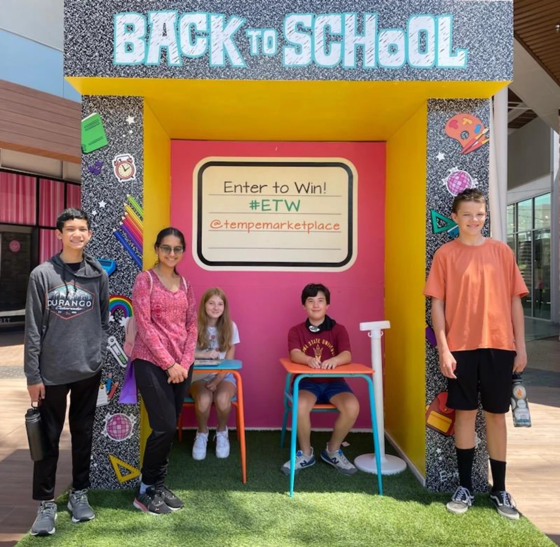 youth group photo in front of back to school display