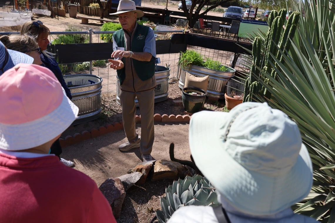 Photo of a master gardener giving a garden tour