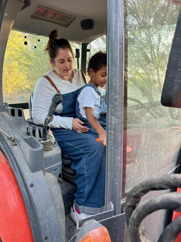 Photo of egg farmers on a tractor