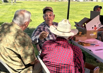 Mohave Master Gardeners sitting at seed table