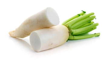 daikon radish cut in half sitting on counter