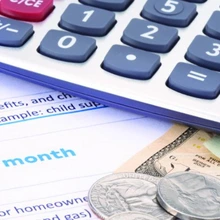 calculator and money on budget documents