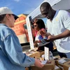 Photo of Henry Osineke Eziama selling eggs at a farmers market